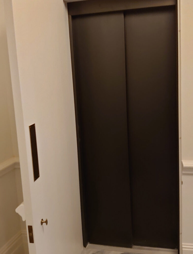 Rich Brown Powder Coated Lift Doors Concealed With House Door